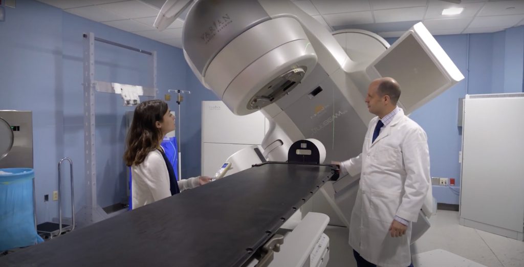 Medical Physics student is introduced to high-precision Varian machine at Duke