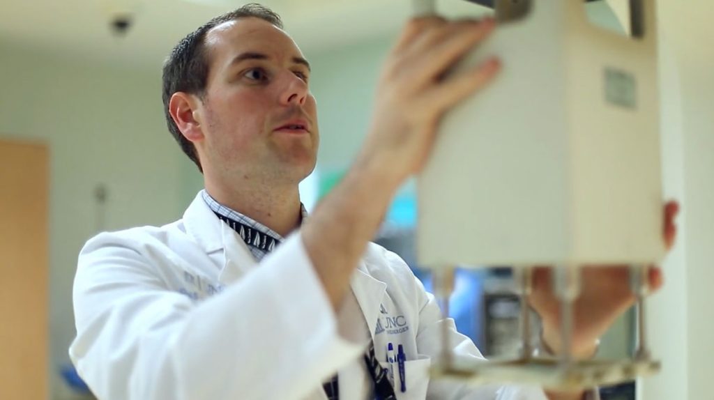 A student conducts research at a lab in Duke's CAMPEP accredited medical physics graduate program